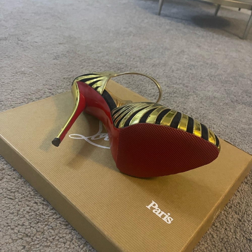 Christian Louboutin gold and black pumps. Worn once.